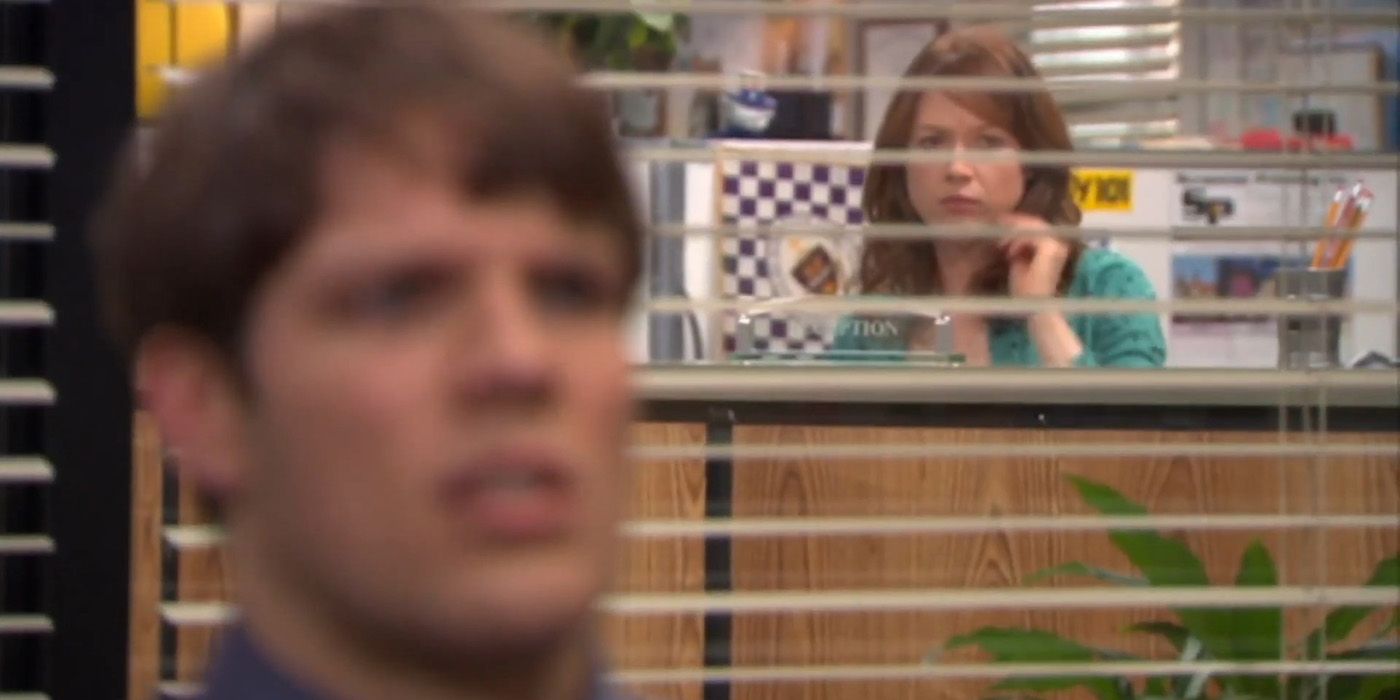 Pete listening to Andy with Erin in the background in The Office