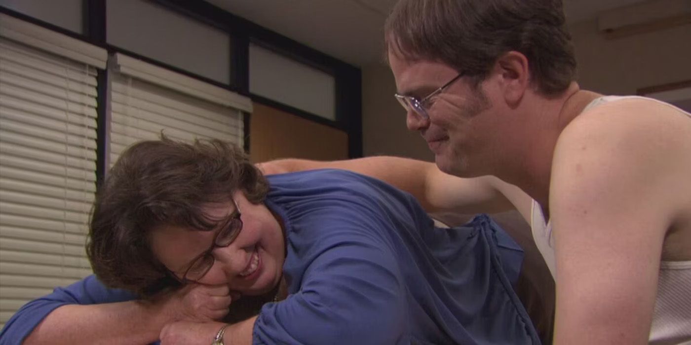 Phyllis (Smith) getting a massage from Dwight (Rainn Wilson) in The Office