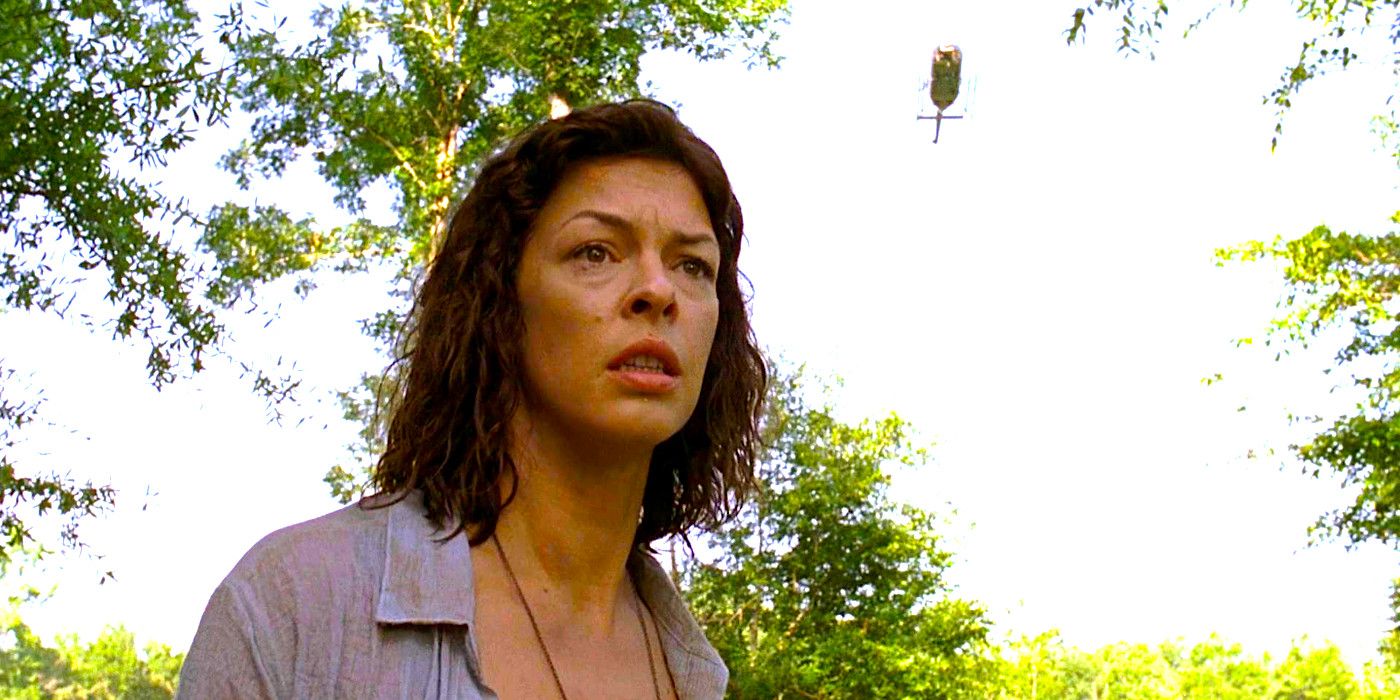 Pollyanna McIntosh poses dramatically as a helicopter hovers far overhead in The Walking Dead season 9