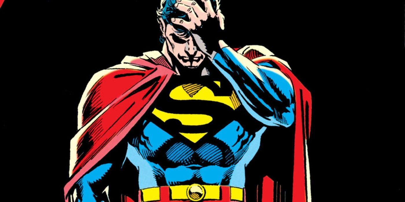 Comic book art: Superman looking down while holding his head.