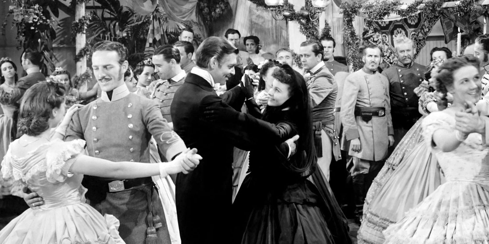 Rhett and Scarlett dancing among a crowd in Gone with the Wind