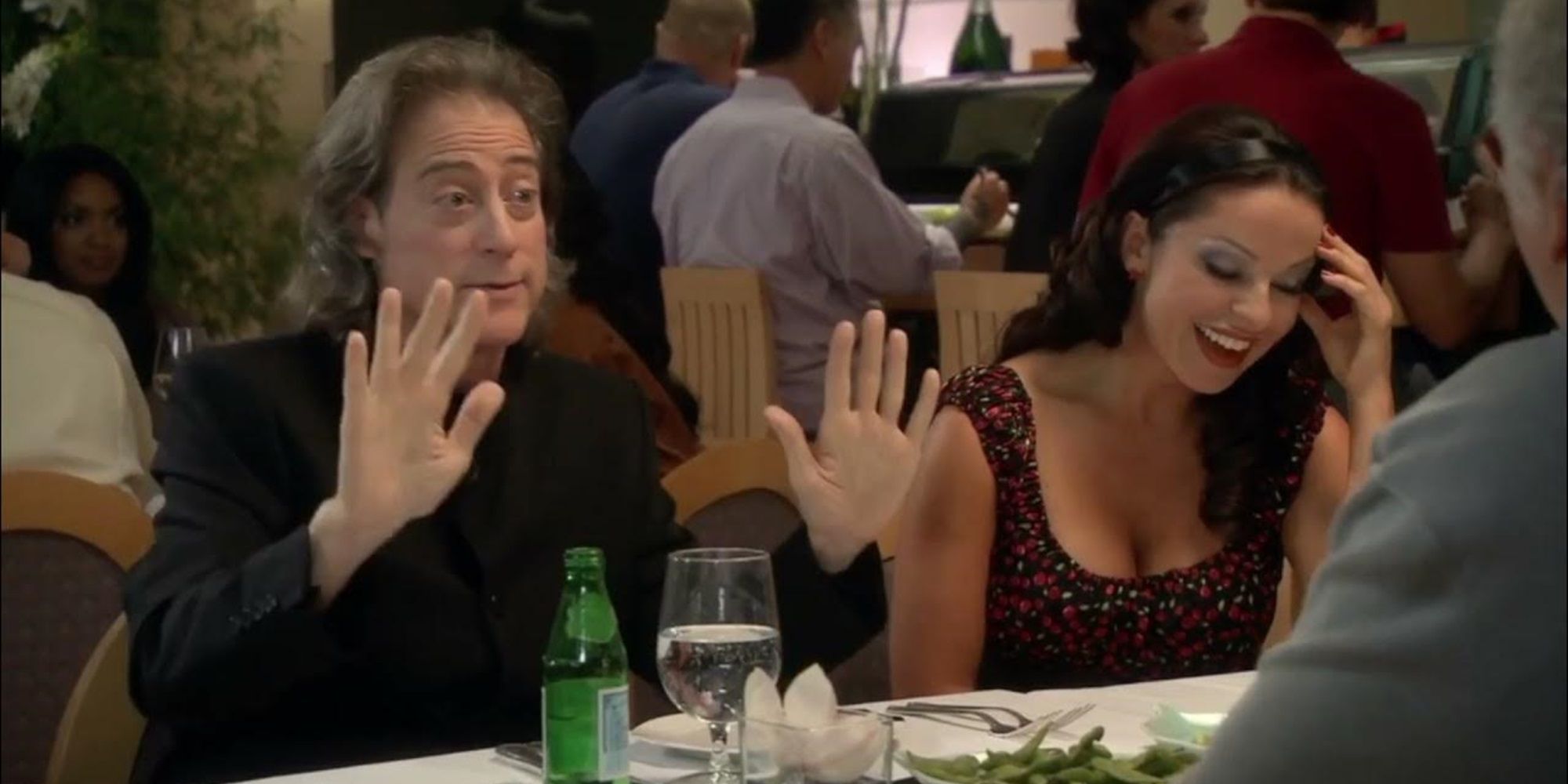 Richard and his girlfriend eat dinner with Larry in Curb Your Enthusiasm
