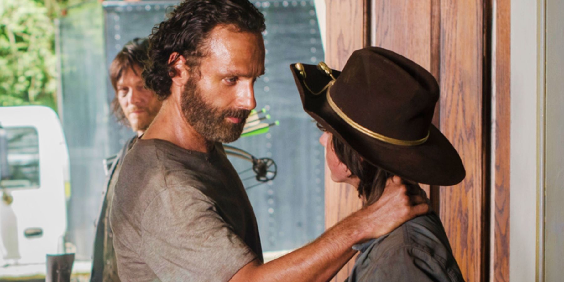 Rick (Andrew Lincoln) with his hand on Carl's (Chandler Riggs) in The Walking Dead