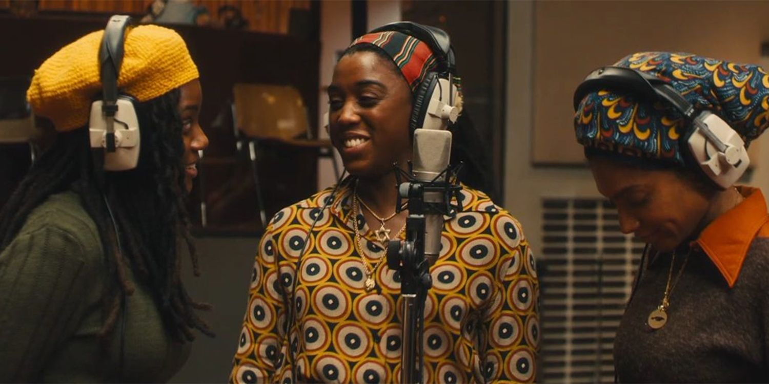 Rita (Lashana Lynch) at the recording studio mic with two other singers in Bob Marley One Love