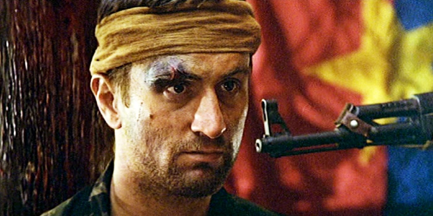 Robert De Niro as Michael with a gun pointed at him in The Deer Hunter