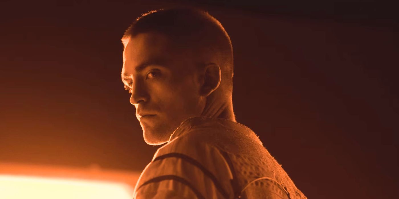 Robert Pattinson looks over his shoulder grimly in High Life
