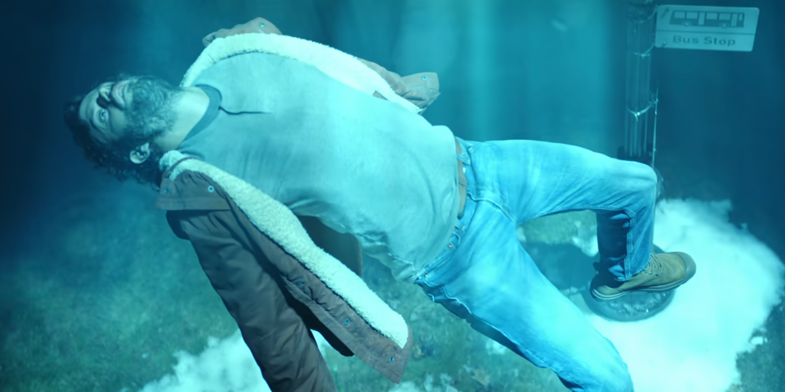 Robert (Paul Piaskowski) gets abducted by aliens and is levitated off a bench in Resident Alien