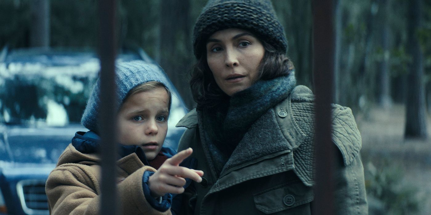 Rosie Coleman as Alice pointing something out to Noomi Rapace as Jo in Constellation
