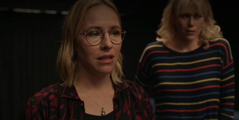 Sally (Sarah Goldberg) looking nervous with Kristen (Ellyn Jameson) crying behind her in Barry season 4 episode 3.