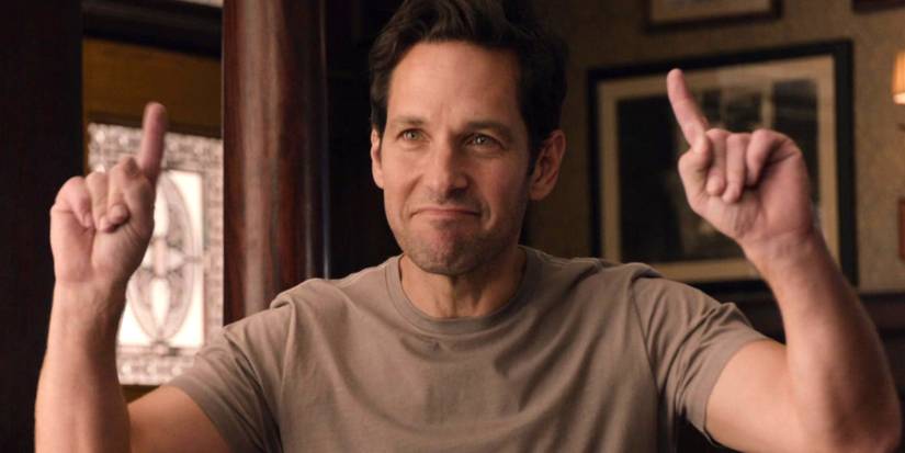 Paul Rudd as Scott Lang in Ant-Man holding up his hands in a "number 1" pose