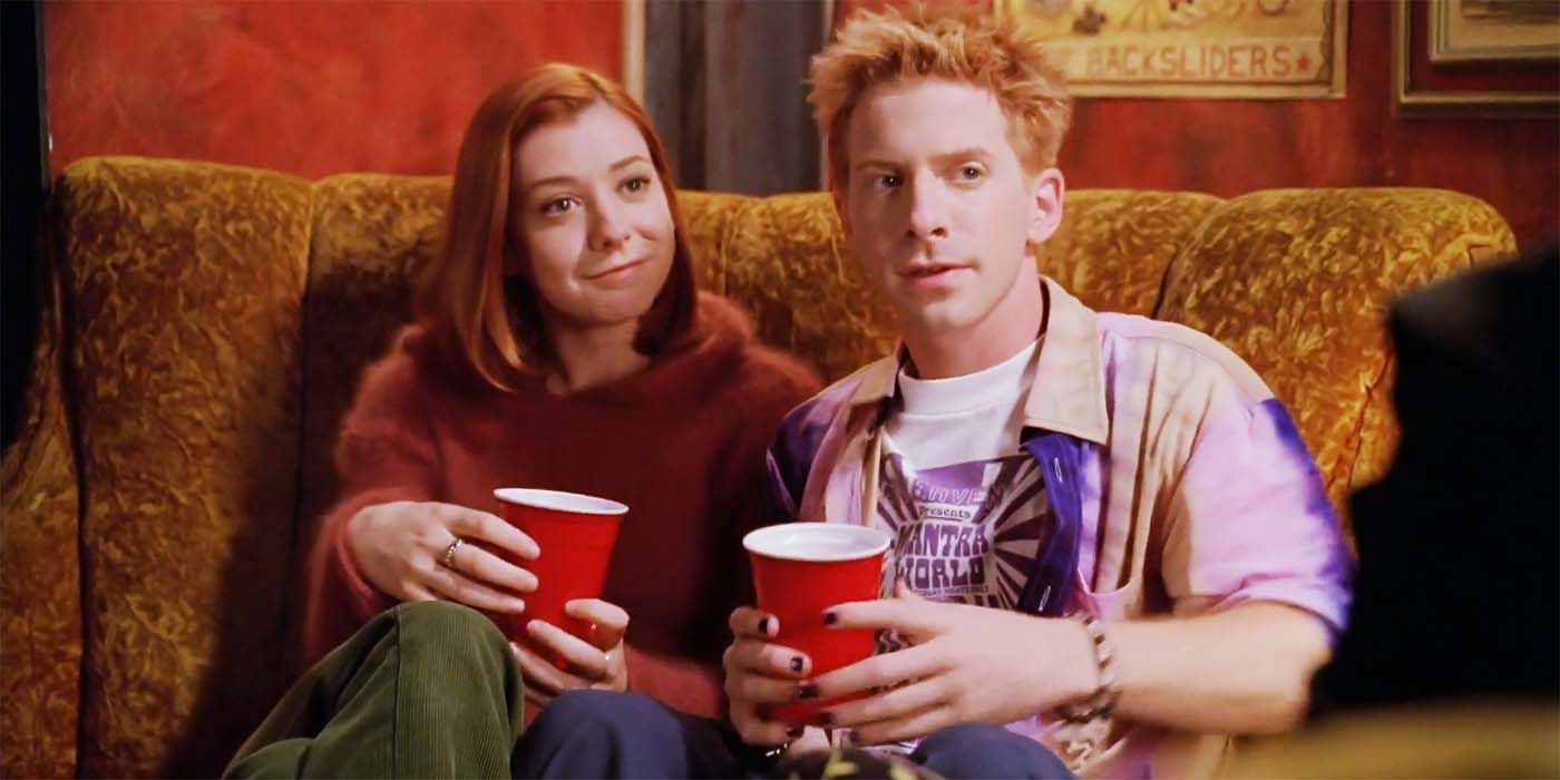 Seth Green and Alyson Hannigan having a drink in Buffy the Vampire Slayer season 3