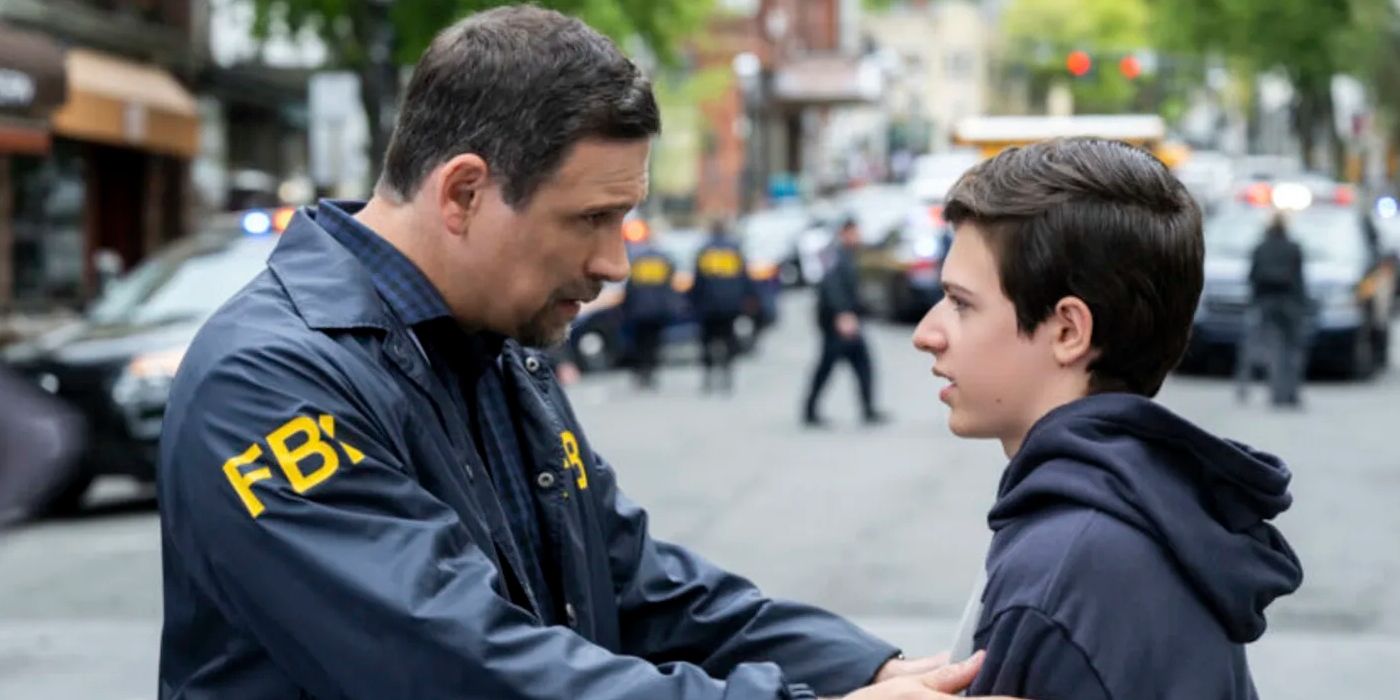 Jeremy Sisto as Jubal Valentine holding a child on FBI