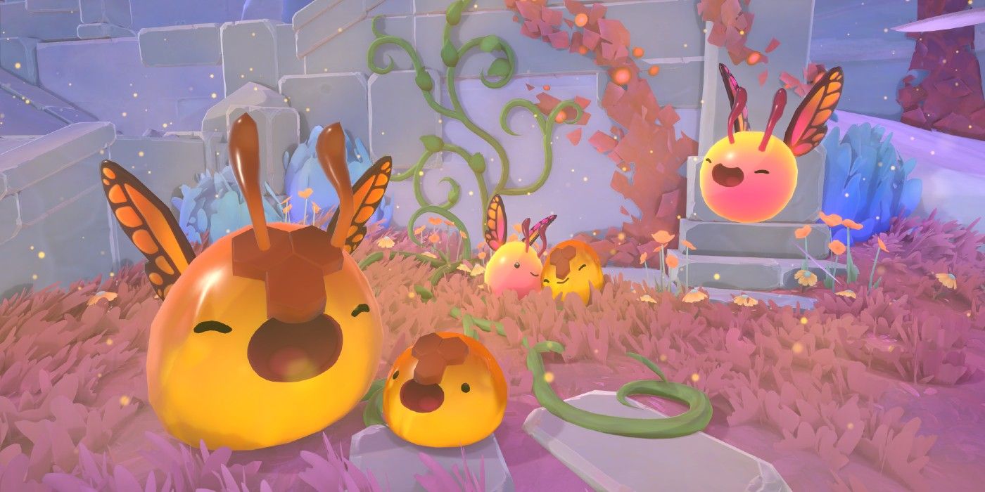 Slime Rancher 2 slimes with monarch butterfly wings rejoicing and looking happy.