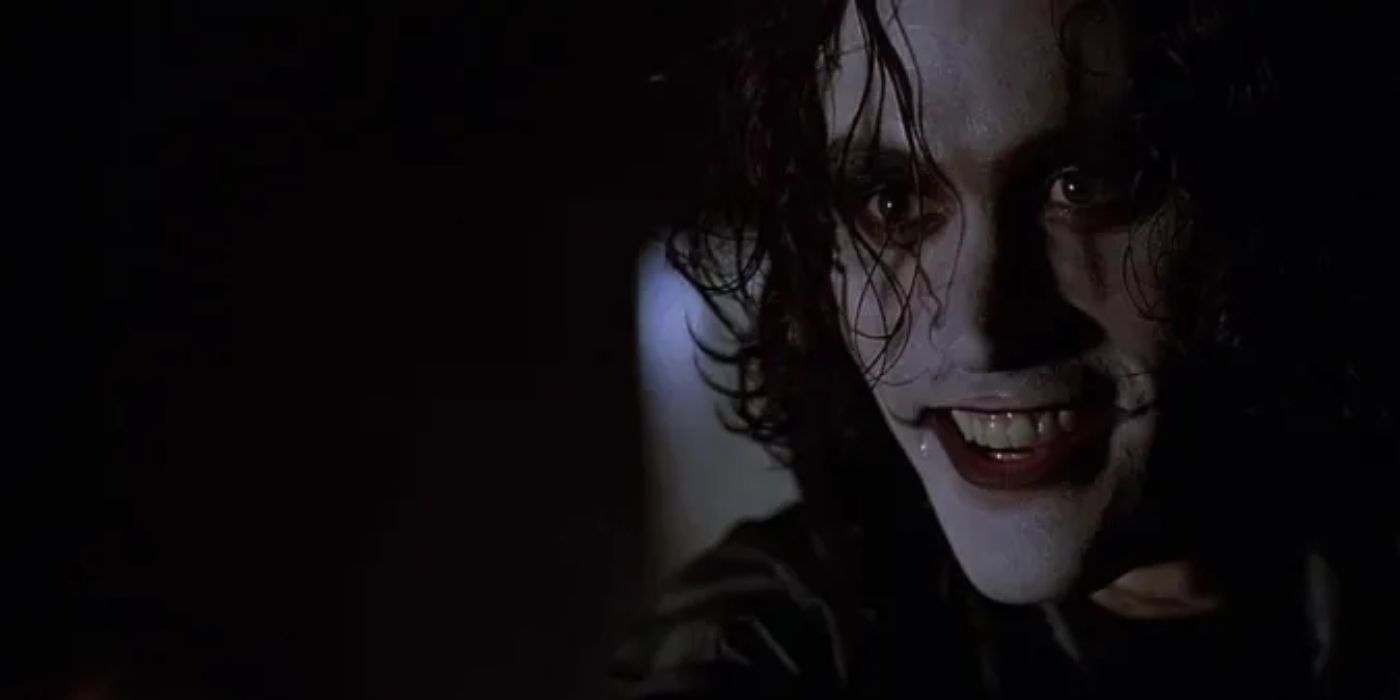 Brandon Lee as The Crow smiles as an off-screen villain in The Crow (1994).