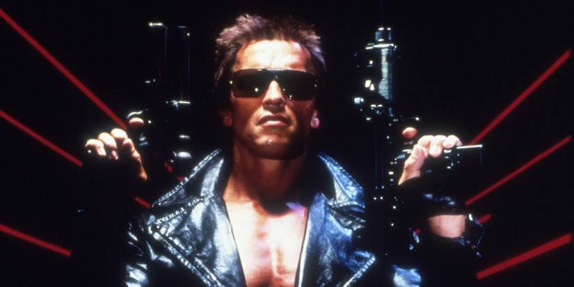Arnold Schwarzenegger as the Terminator holding two guns
