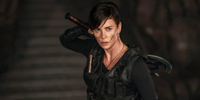 Andy (Charlize Theron) grabbing an axe in The Old Guard