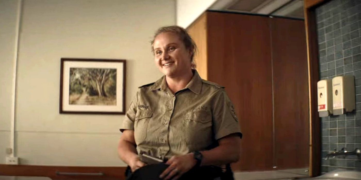 Probationary Constable Helen Chambers (Danielle Macdonald) smiles in The Tourist.