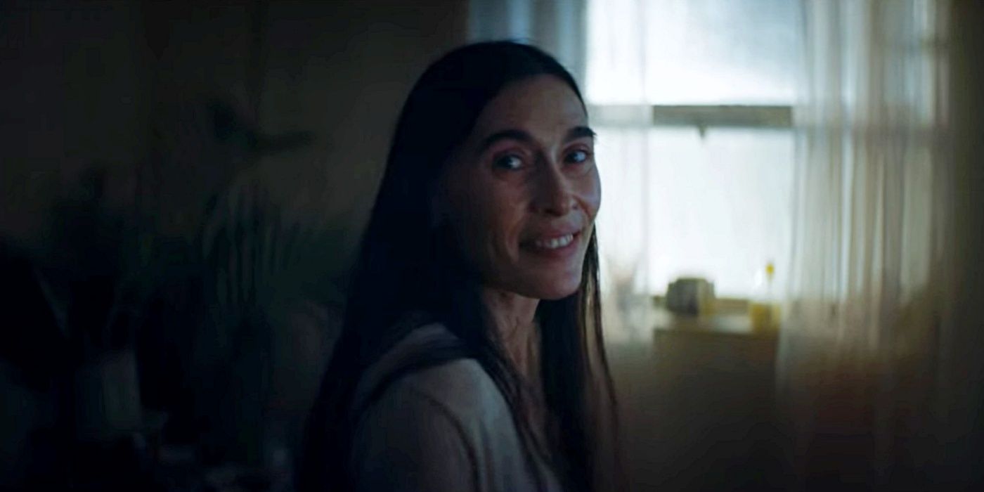 Victoria Haralabidou as Lena Pascal smiling over her shoulder in The Tourist.