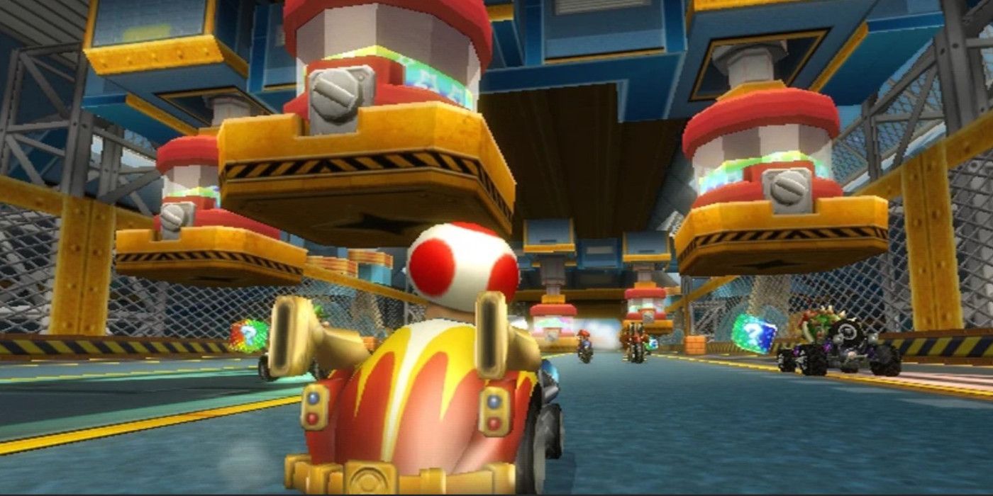 Pista Toads Factory Mario Kart Wii com condução de Toad.