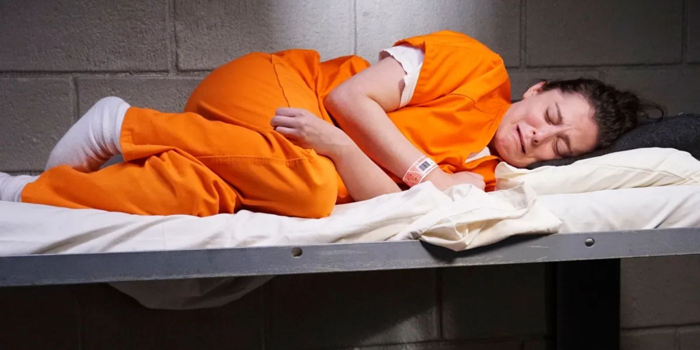 Rebecca Bunch lying in a prison cot crying in Crazy Ex-Girlfriend