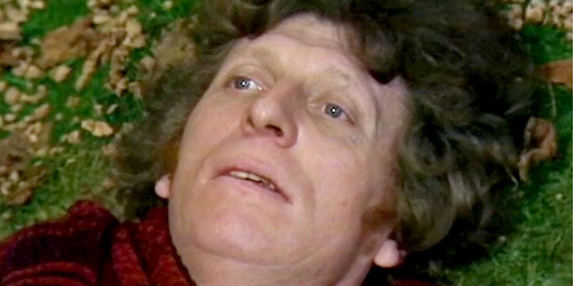 Tom Baker as the Fourth Doctor on the ground during his Doctor Who regeneration scene