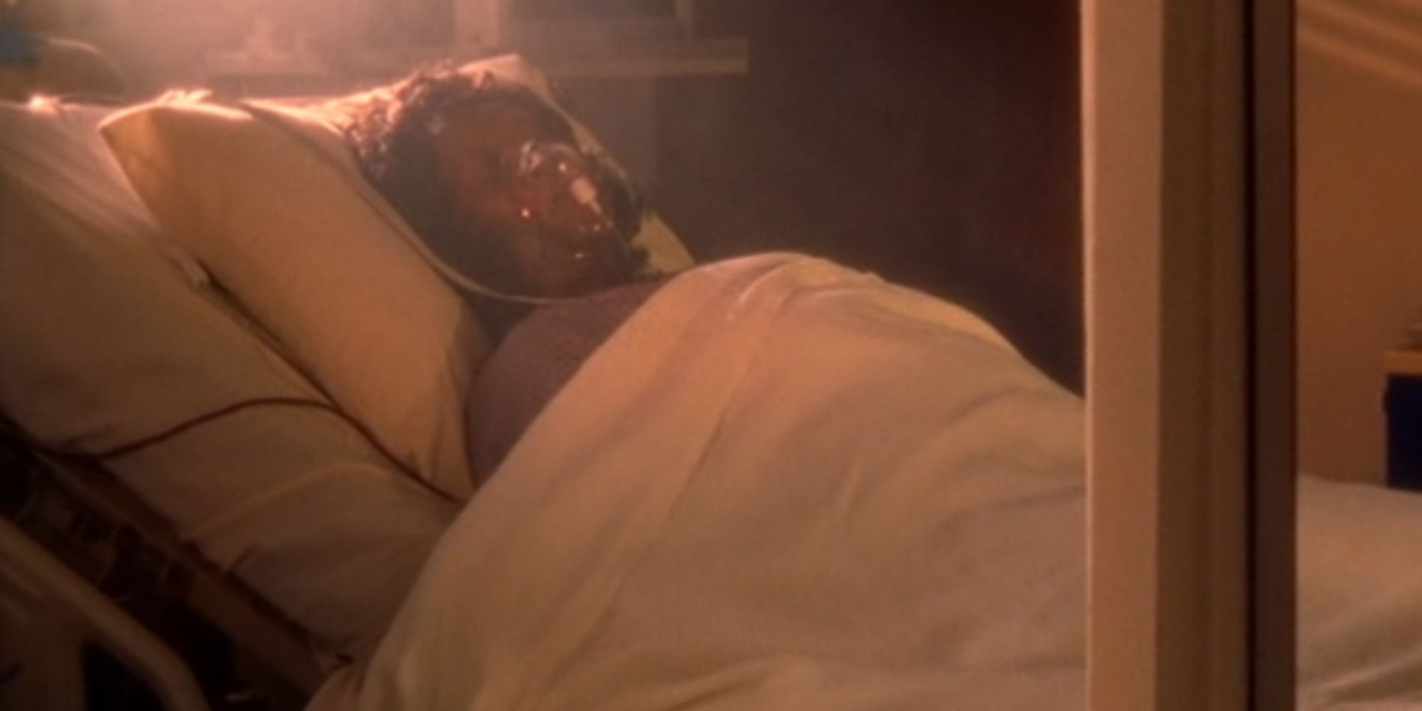 Aloma Wright as Laverne Roberts in a hospital bed with an oxygen mask in Scrubs