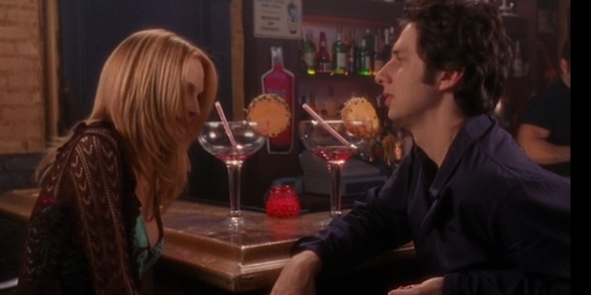 Heather Graham as Molly Clock sitting in a bar with Zach Braff as JD in Scrubs