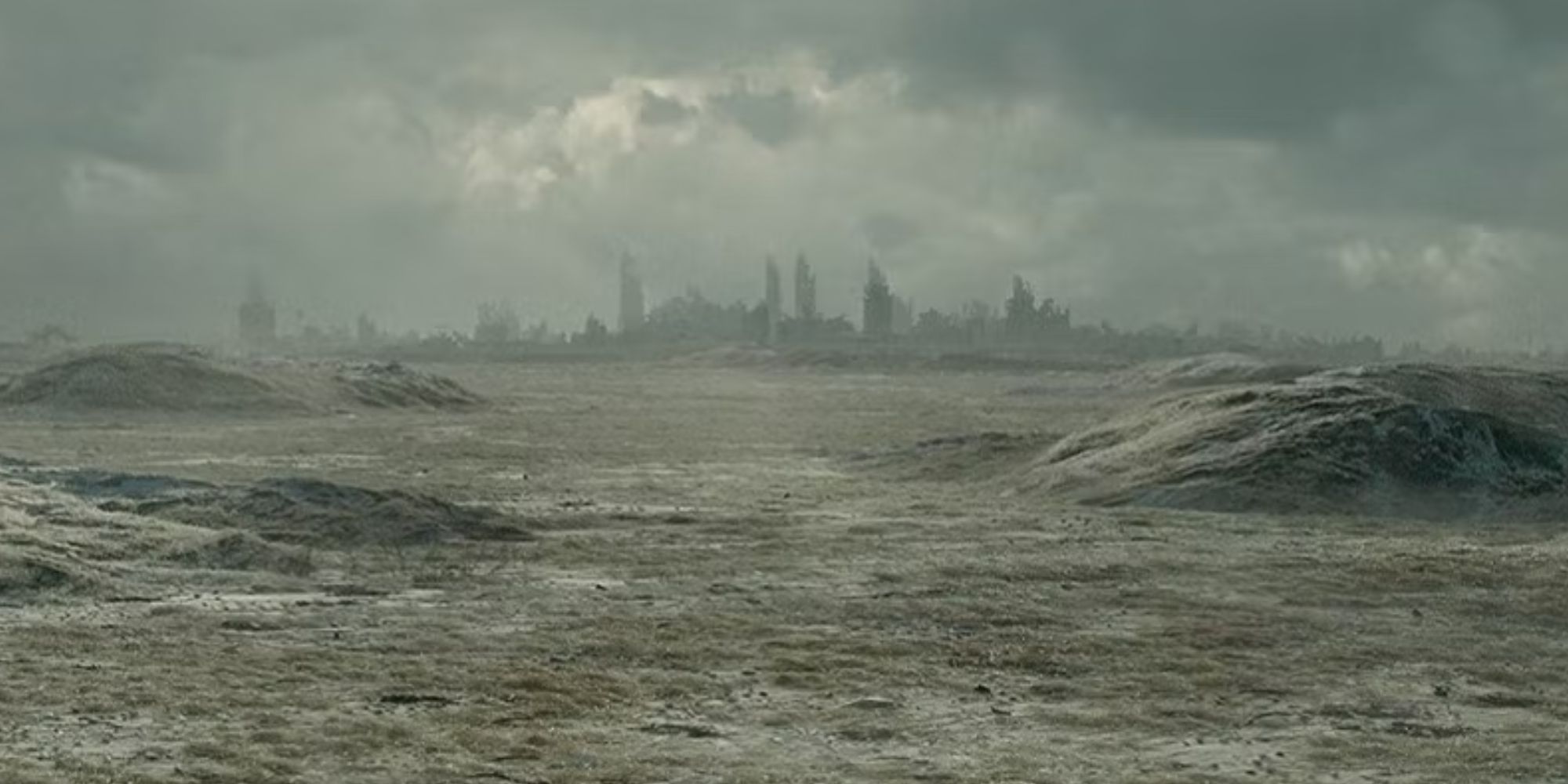 A ravaged, decaying city skyline in the distance in Silo