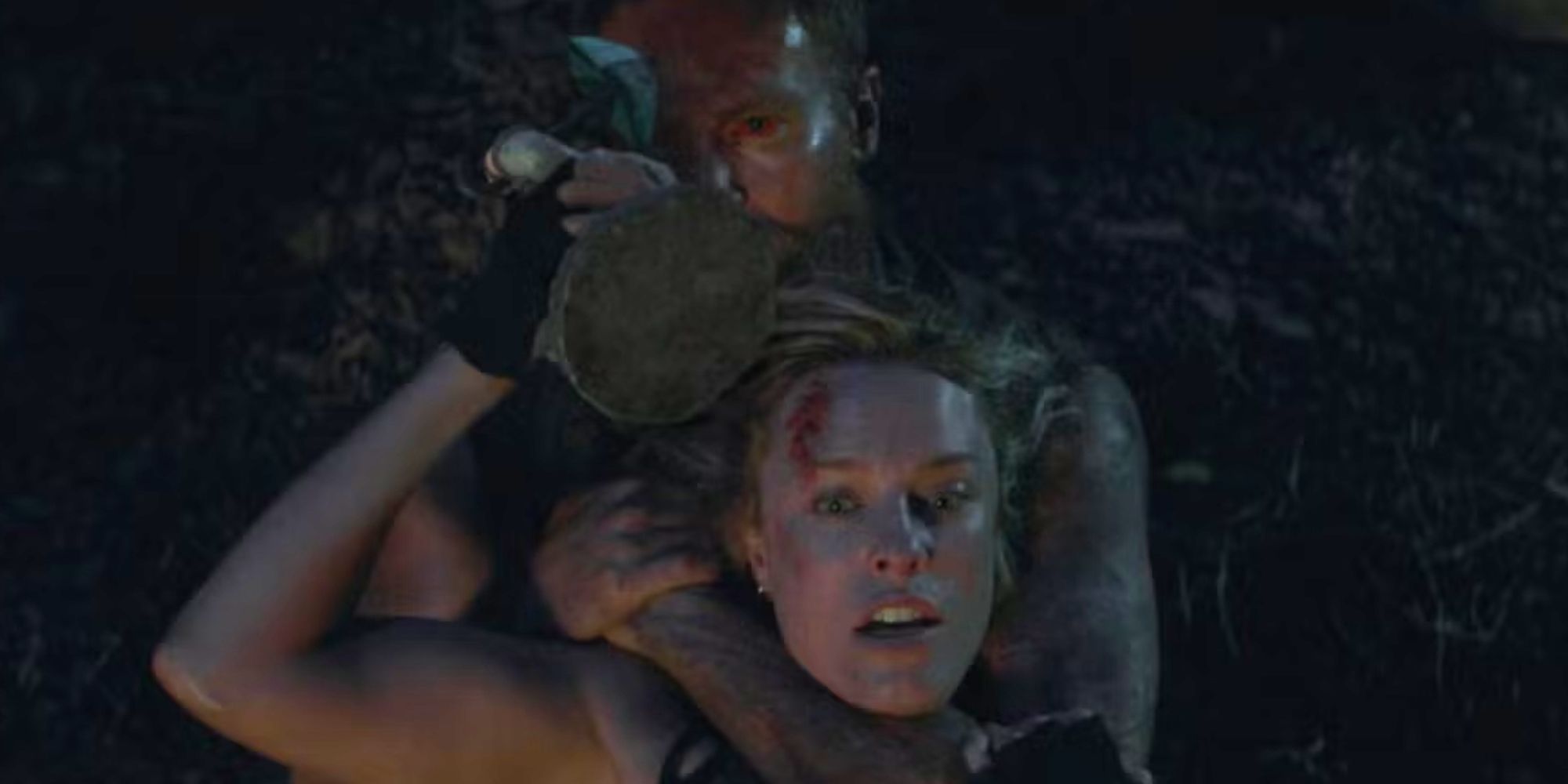 Jessica McNamee as Sonya Blade stabbing Josh Lawson as Kano in the eye in 2021's Mortal Kombat