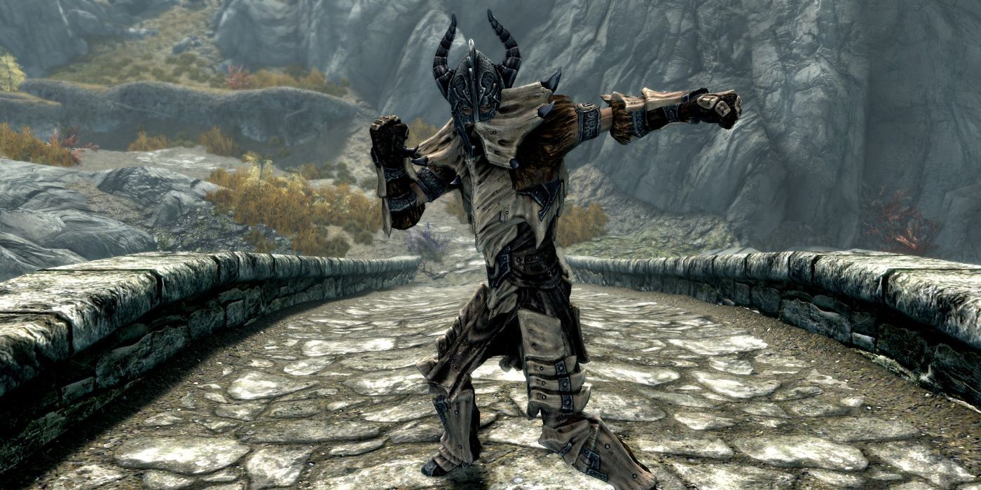 A Skyrim warrior in Dragonplate Armor striking a heroic pose on a stone bridge