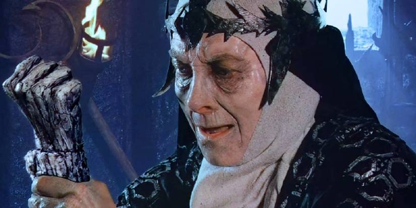 Jean Marsh as Queen Bavmorda in Willow, watching her hand crumble