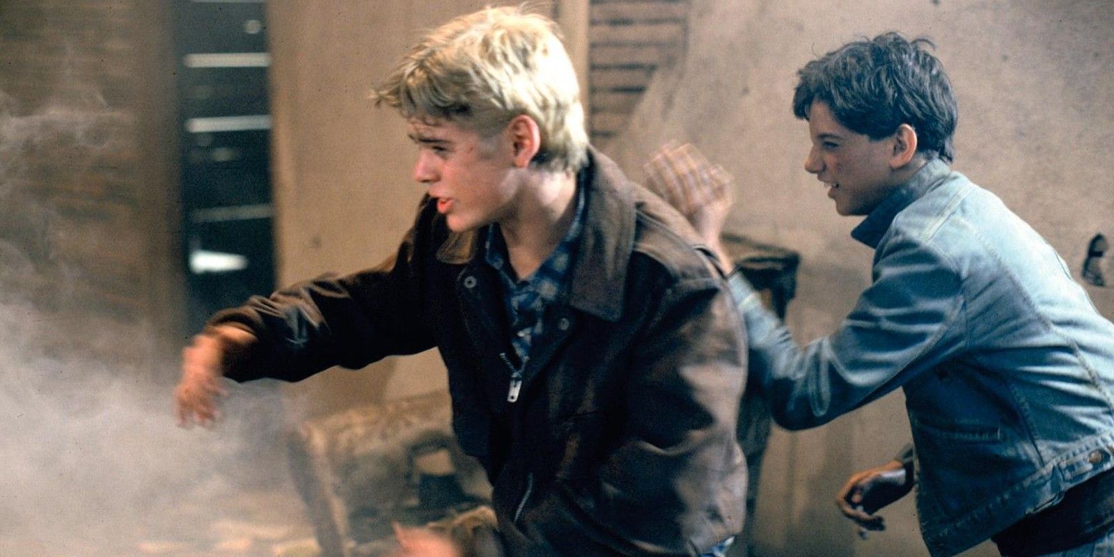 C. Thomas Howell as Pony Boy and Ralph Macchio as Johnny in the church fire in The Ousiders