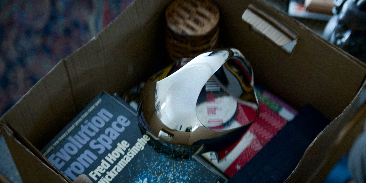 Shot of a box with stuff and a shiny looking headset in 3 Body Problem