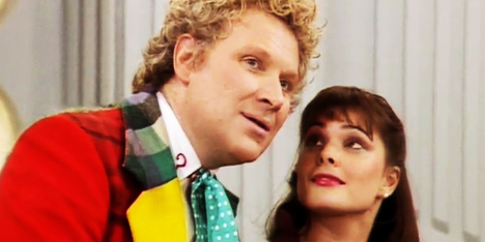 Nicola Bryant as Peri Brown smiling at Colin Baker as the Sixth Doctor in Doctor Who