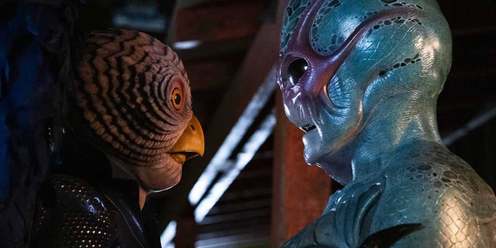 Heather and Harry holding each other in their alien forms in Resident Alien