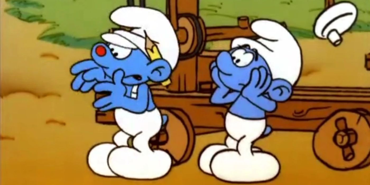 Um Smurf com um ponto vermelho no nariz fica na frente de outro Smurf parecendo preocupado em Smurfs.