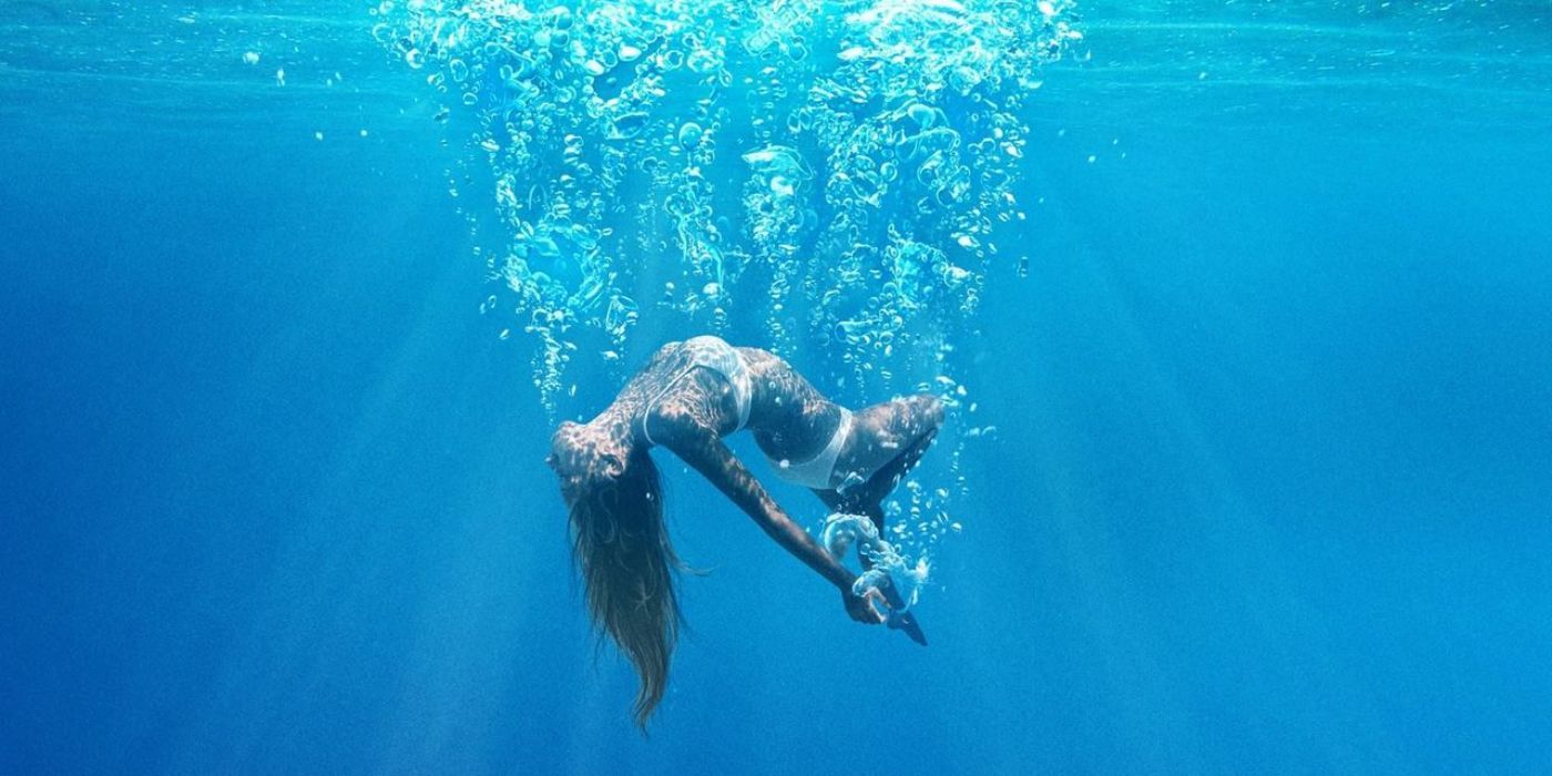 A woman falling through the water in Under the Silver Lake.