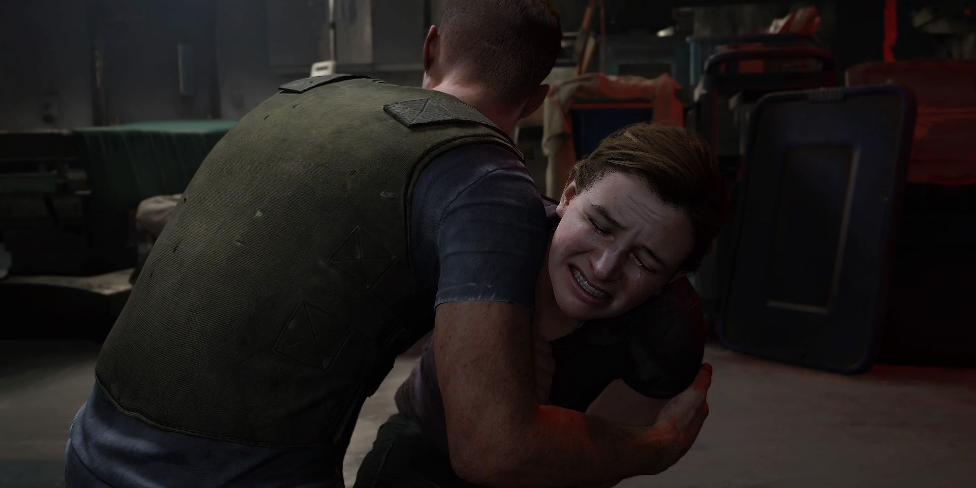 Abby chorando nos braços de Owen em The Last of Us Part II