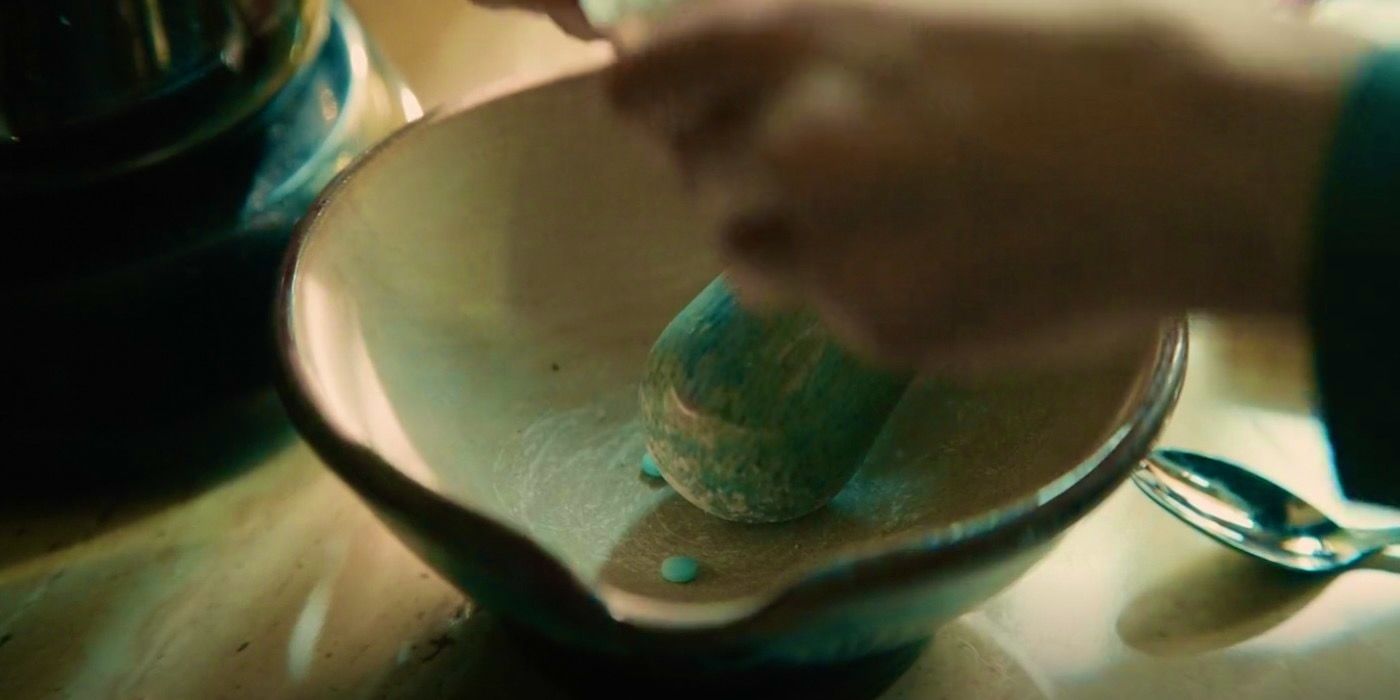Agnes (Andrea Riseborough) crushing epilepsy tablets in The Regime episode 2