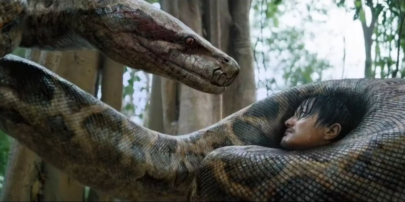 Anaconda 2024 remake snake wrapped around the neck of a man