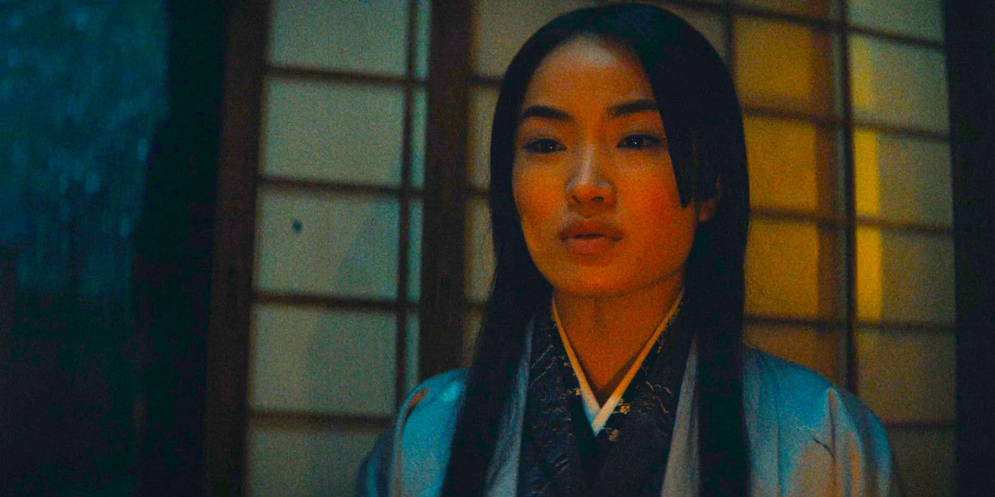 Anna Sawai as Mariko in dim lighting telling a story in Shogun episode 5