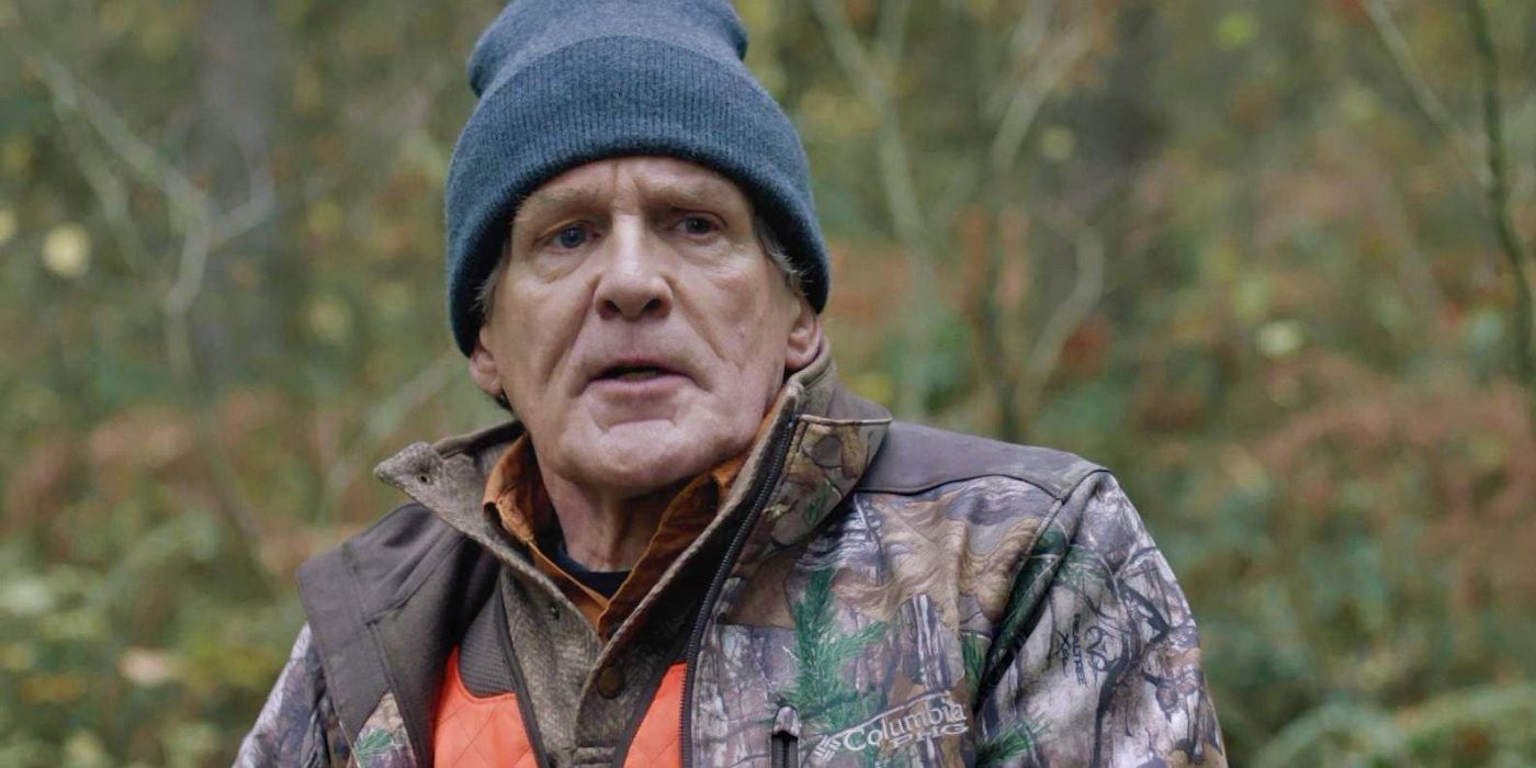 Anthony Heald as Robert standing in the woods in Alone (2020)