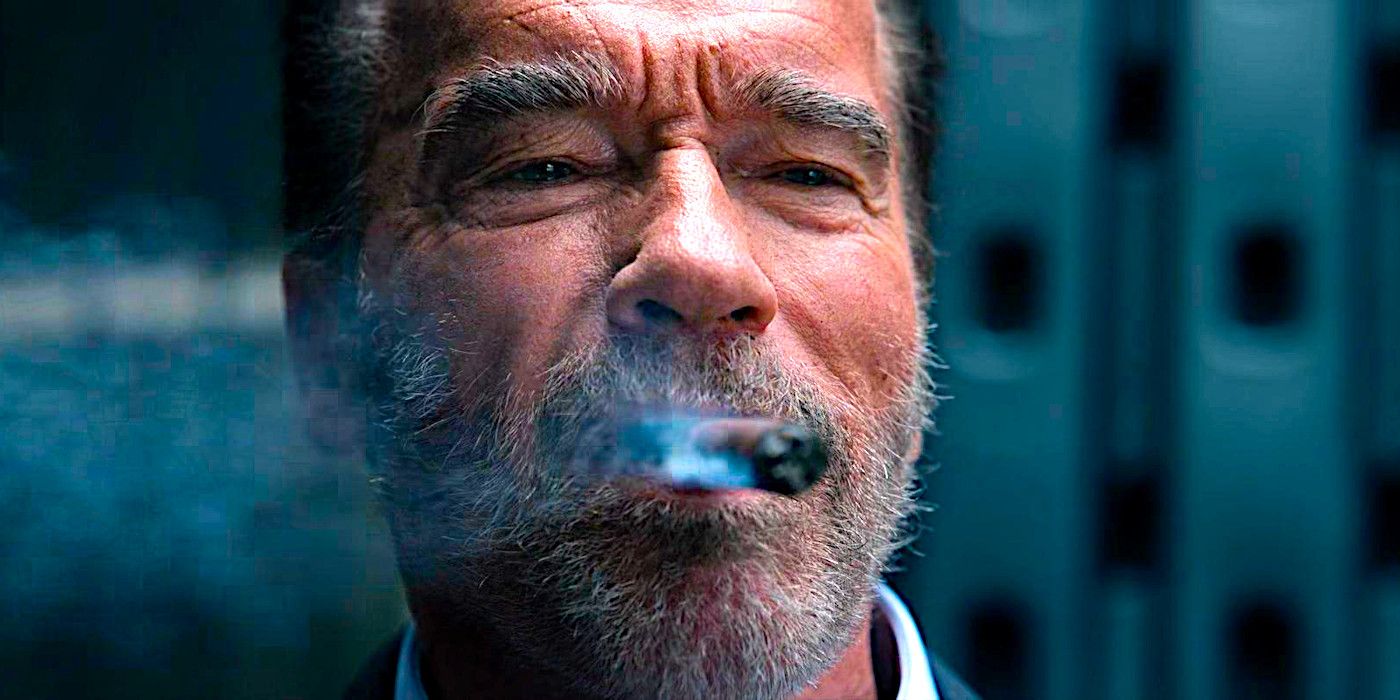 Arnold Schwarzenegger grins while smoking a cigar in a scene from FUBAR season 1