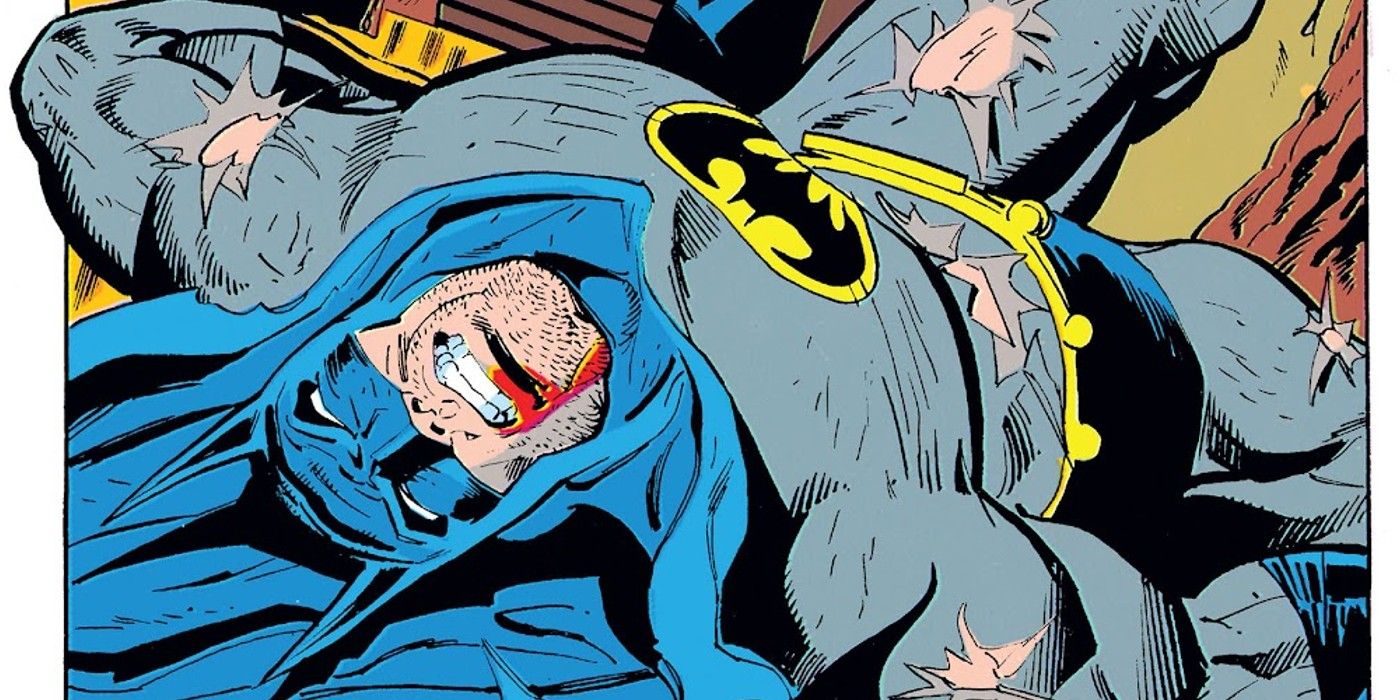 Comic book panel: Batman in pain on the floor.