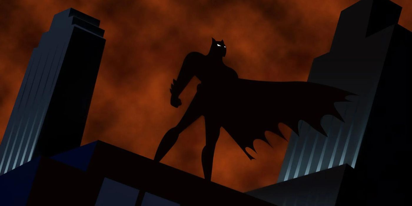 Batman standing atop a building in Batman The Animated Series