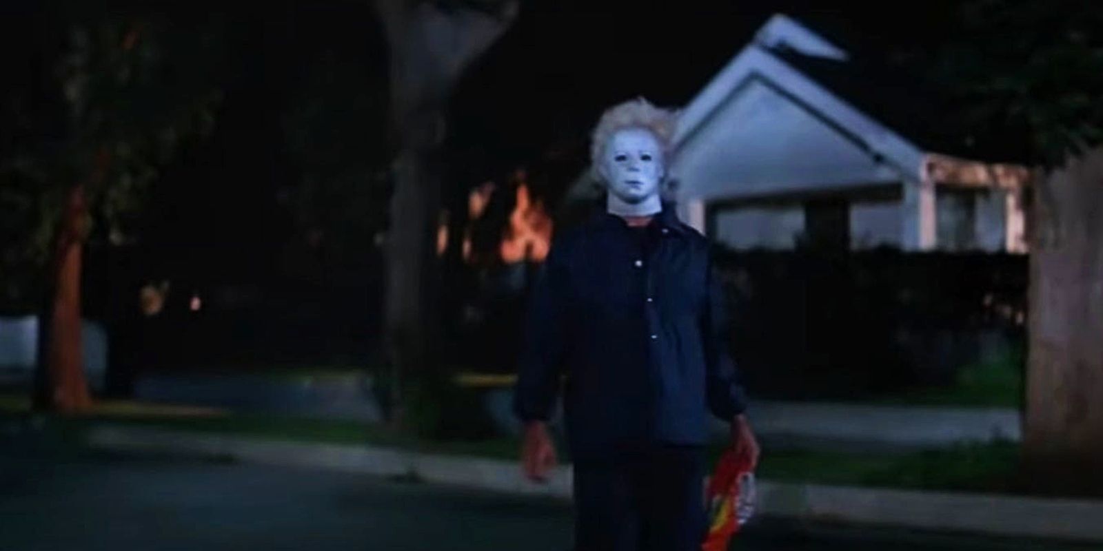 Ben Tramer stands in front of a house in Halloween