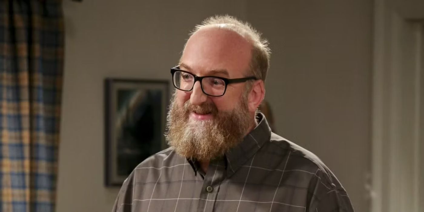 Bert Kibbler smiling to someone off camera on The Big Bang Theory 