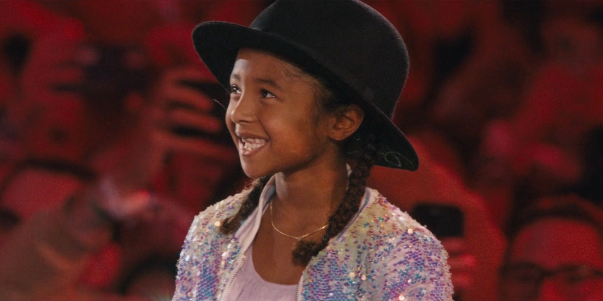 Bianka Bryant smiles while wearing the &ldquo;22&rdquo; hat in Taylor Swift: The Eras Tour concert movie.