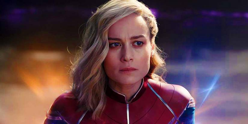 Brie Larson as Captain Marvel looking pensive in outer space in The Marvels.