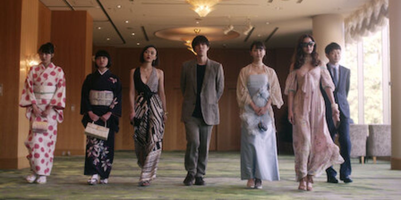 Cast of Million Yen Women walking down a corrider